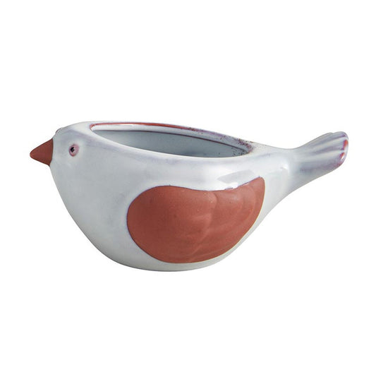 White ceramic bird-shaped succulent planter with red accents on wings and beak.
