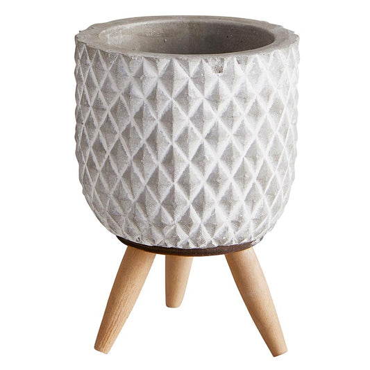 Small textured cement planter with a diamond grid pattern, supported by three light wood legs.