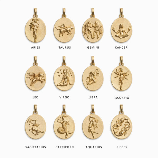 Gold zodiac pendants set, each with a detailed astrological sign carving, labeled Aries, Taurus, Gemini, Cancer, Leo, Virgo, Libra, Scorpio, Sagittarius, Capricorn, Aquarius, Pisces.