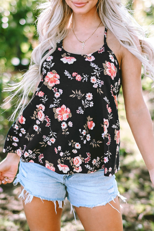 Black floral tank top paired with light denim shorts, worn by a person with long blonde hair in an outdoor setting.
