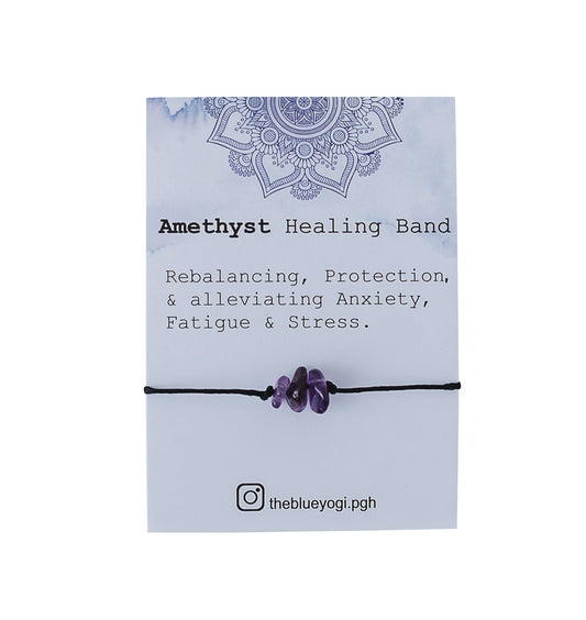 Amethyst Healing Band with purple stones and black cord on a card describing its benefits, including alleviating anxiety, fatigue, and stress. Instagram handle theblueyogi.pgh is visible at the bottom.